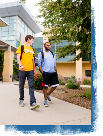 Two student walking on campus.